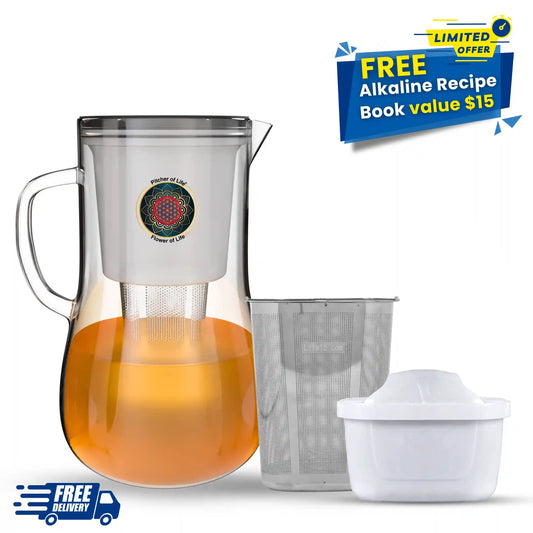 Clear pitcher with liquid and a book titled 'Alkaline Beverage Recipes' on a white background