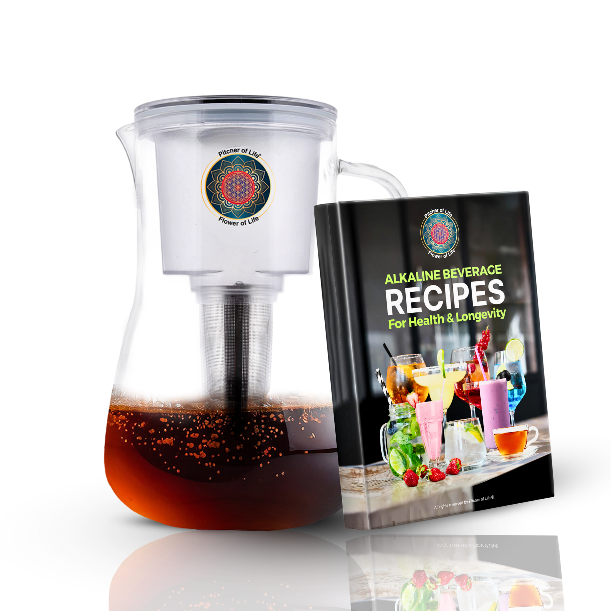 Clear pitcher with dark liquid and a book titled 'Alkaline Beverage Recipes' on a white background