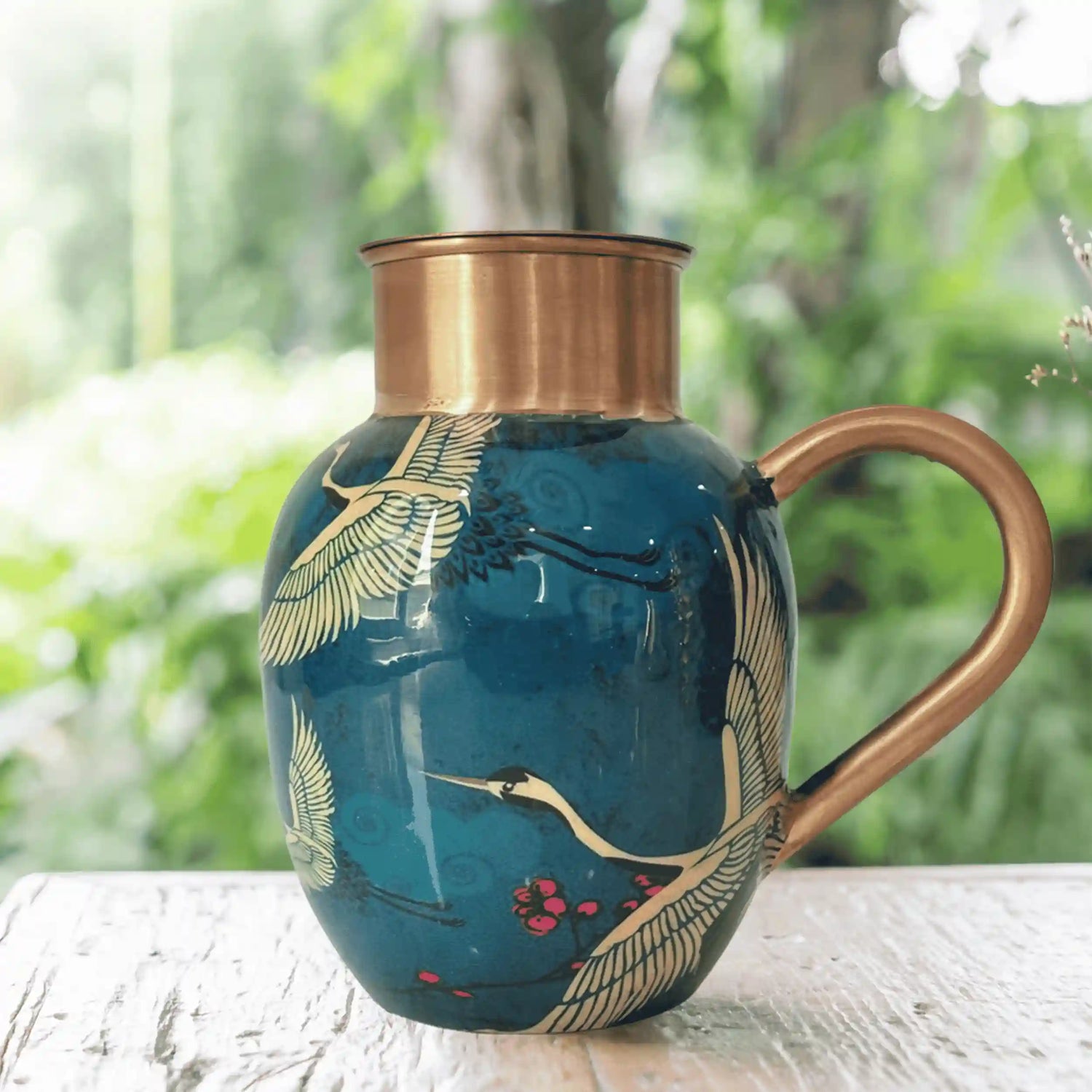 copper pitcher with flower design