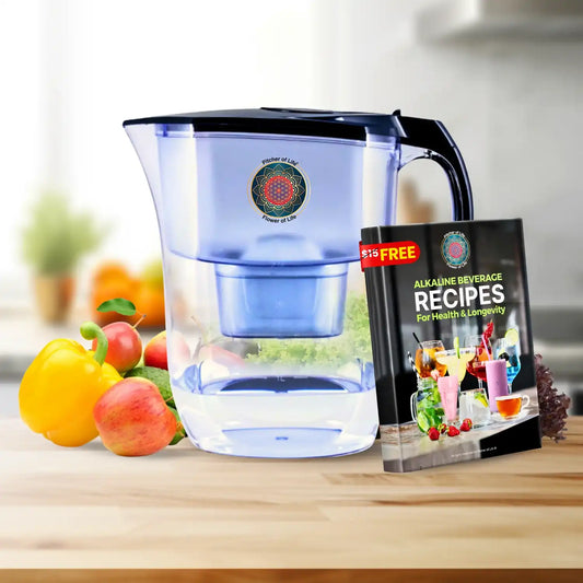 Blue water pitcher with a free alkaline beverage recipes book on a kitchen counter.